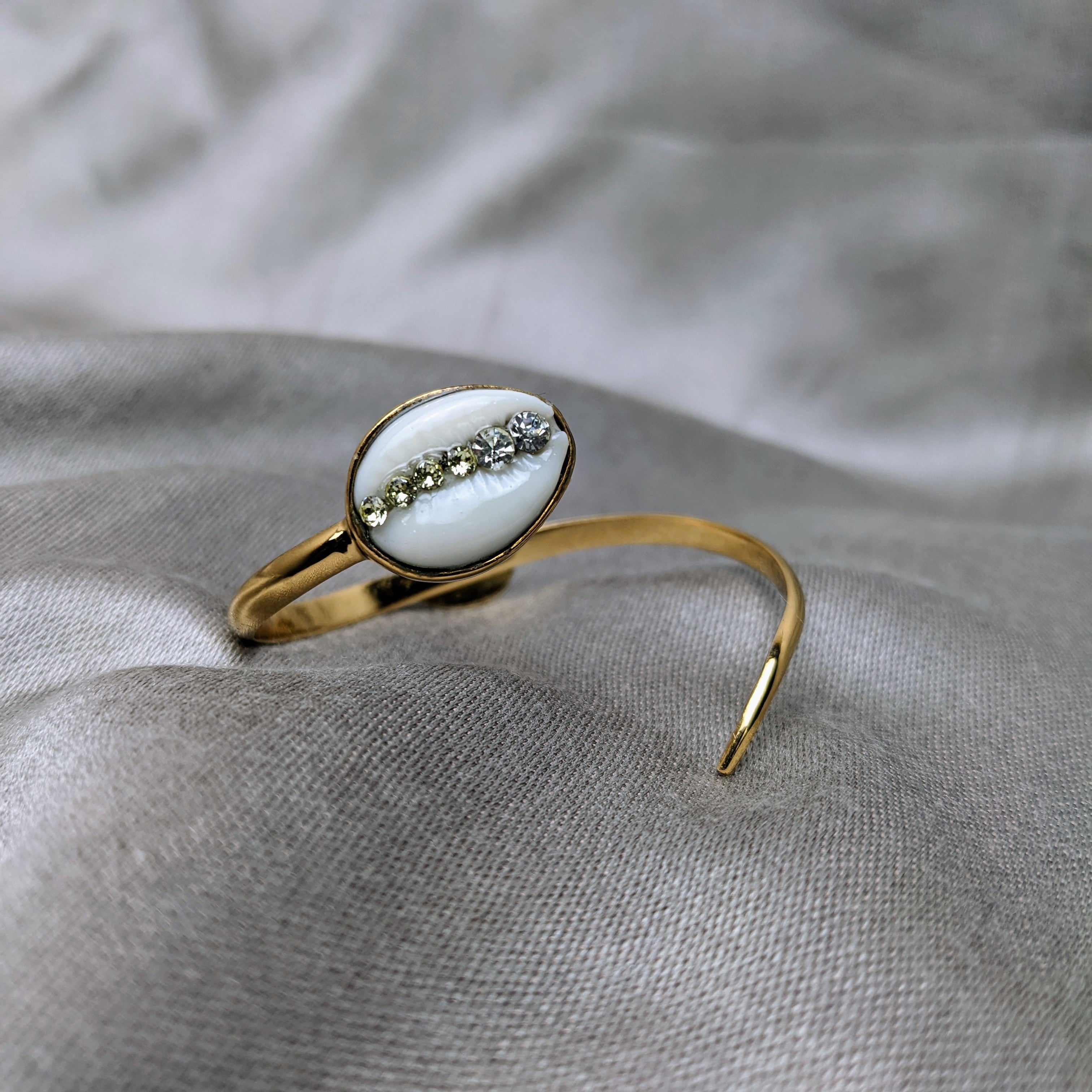 Gold on sale cowrie bracelet